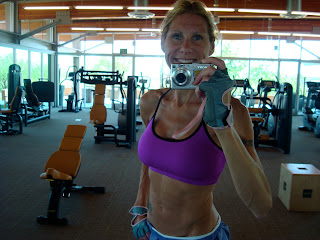 Close up of woman taking photo of self at gym