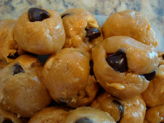 Close up of stacked No-Bake Vegan Peanut Butter Chocolate Chip Cookie Dough Balls