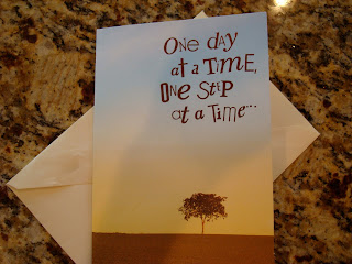 Card that says one day at a time, one step at a time