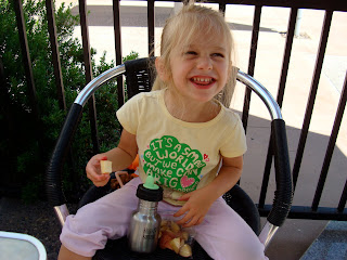 Young girl sitting on chair eating snacks - 51