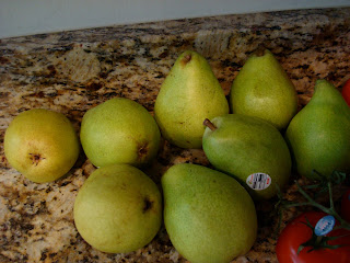 Multiple pears on countertop