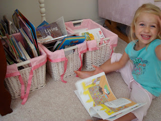 Young girl sitting on floor look at book