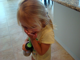 Young girl standing laughing