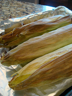 Side view of oven roasted corn in husks