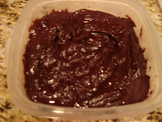 Brownie batter after it has been frozen in clear container