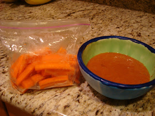 Bag of sliced carrots and a cinnamon dipping sauce in blue and green bowl