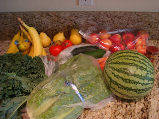 Mixture of purchased fruits and vegetables on countertop