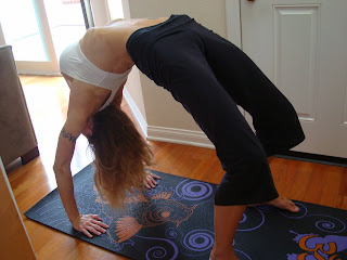 Woman doing Urdhva Dhanurasana yoga pose - 21
