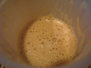 Inside cup showing protein powder mixed with water