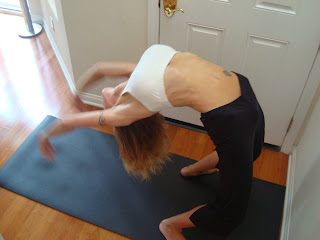 Woman doing Urdhva Dhanurasana yoga pose