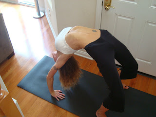 Woman doing Urdhva Dhanurasana yoga pose - 29