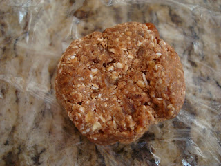 Raw Oatmeal Cookie on plastic wrap on countertop