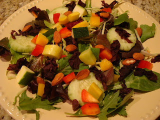 Greens with mixed vegetables and Dulse Flakes on white plate