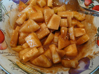 Diced apples, cinnamon, brown sugar and agave in bowl mixed up