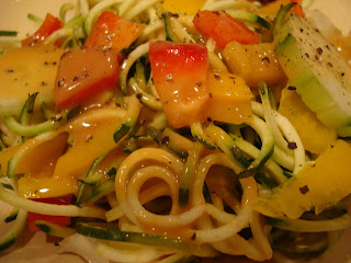 Spiralized zucchini with vegetables drizzled with peanut sauce