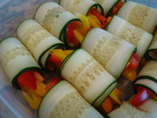 Close up of cucumber wraps in container