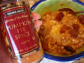 Banana Pumpkin Pie Oats in bowl with hand holding Pumpkin Pie Spice