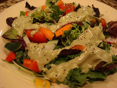 Salad topped with Raw Herbalicious Goddess Dressing