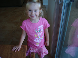 Young girl wearing pink smiling