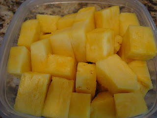 Container full of diced pineapple
