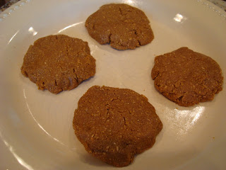 Blended ingredients formed into four cookies on white plate