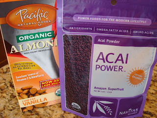 Container of Organic Almond Milk and Package of Acia Powder