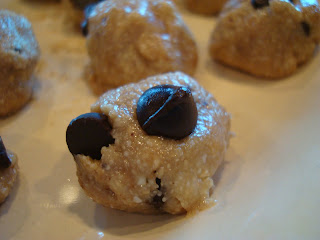 One Raw Vegan Chocolate Chip Cookie Dough Ball on white plate