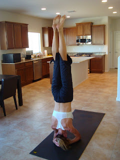 Woma doing Sirsana yoga pose