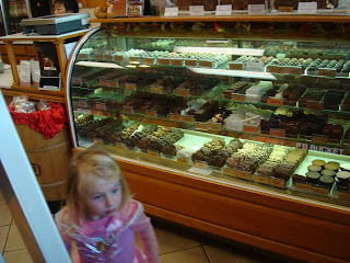 Young girl in halloween costume in candy store