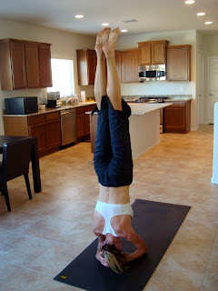 Woman doing Sirasana yoga pose