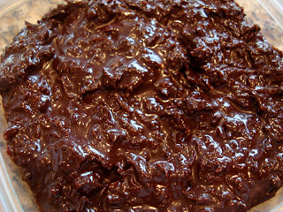 Overhead of Raw Vegan Chocolate Coconut Snowballs in clear container - 29