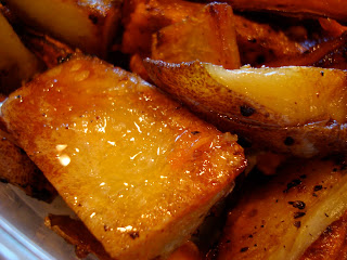 Close up of white potatoes after roasting in pan