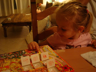 Little girl playing with advent calendar - 15