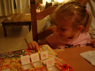 Little girl playing with advent calendar