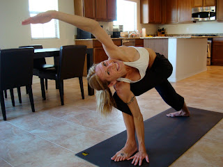Woman doing Parivrtta Parsvakonasana yoga pose