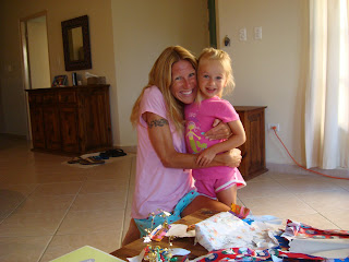 Woman hugging young girl smiling