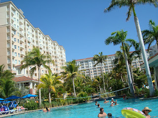 Large building complexes with pool and palm trees