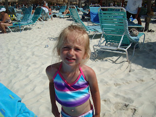 Young girl standing on beach in swim suit - 55