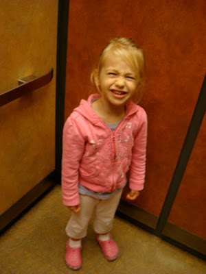 Young girl inside elevator