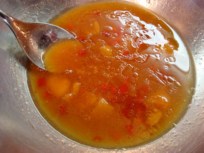 Ingredients being stirred with spoon