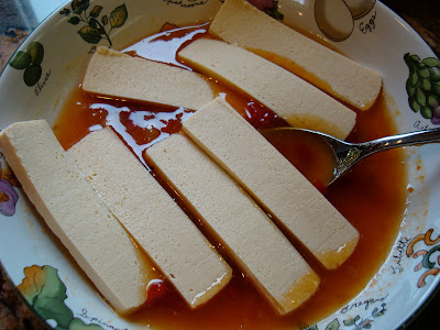 Sliced up tofu in marinade