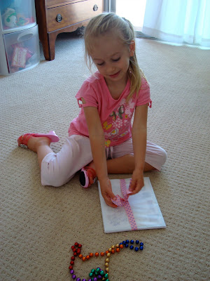 Young girl sitting on floor opening gift - 35
