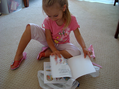 Young girl looking at book on floor - 41