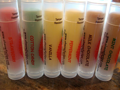 Various lip balms lined up on countertop - 31