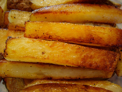 Overhead of stacked Coconut and Olive Oil Roasted Potato Sticks