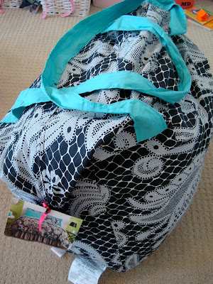 Black and teal bedding set in bag