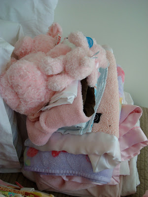 Stack of blanket and baby toys
