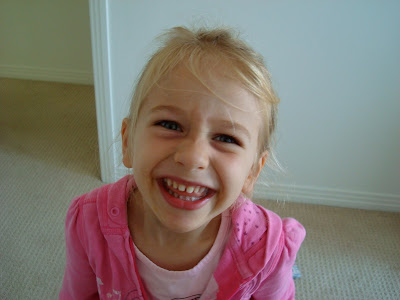 Close up of little girls face smiling - 37