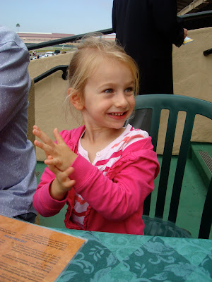 Young girl sitting and clapping