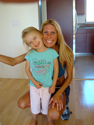 Woman and young girl between her legs smiling - 23